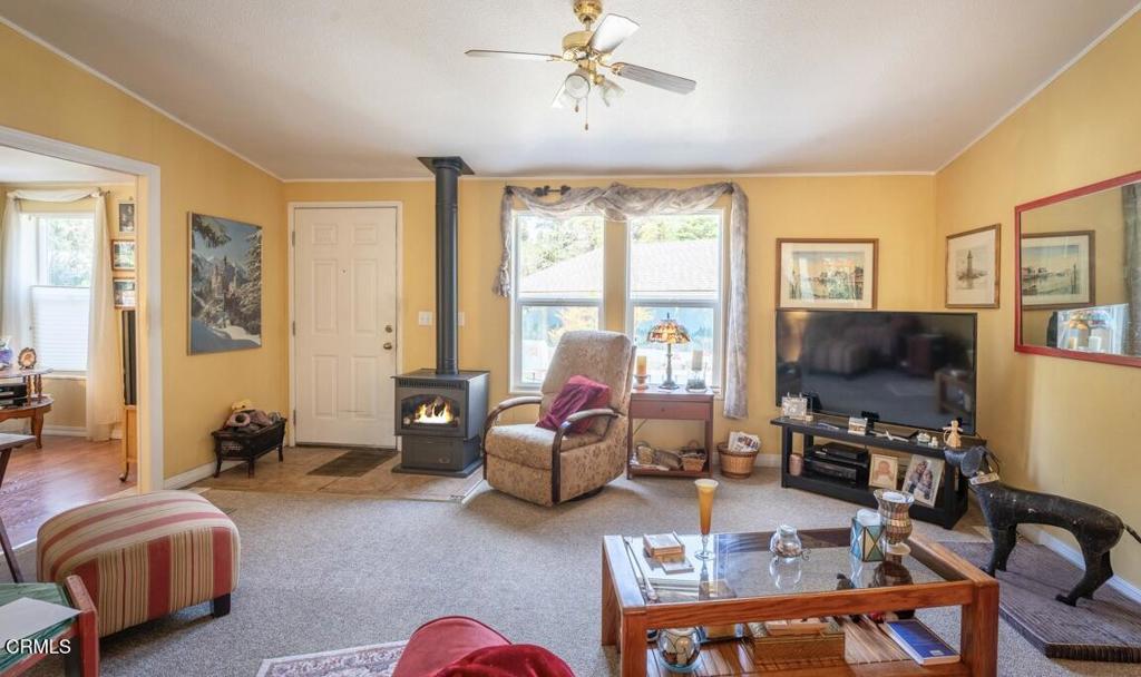 43300 Little River-Airport Road, Unit 90 Little River, CA 95456 - Photo 7 of 21 a living room with furniture a flat screen tv and a window
