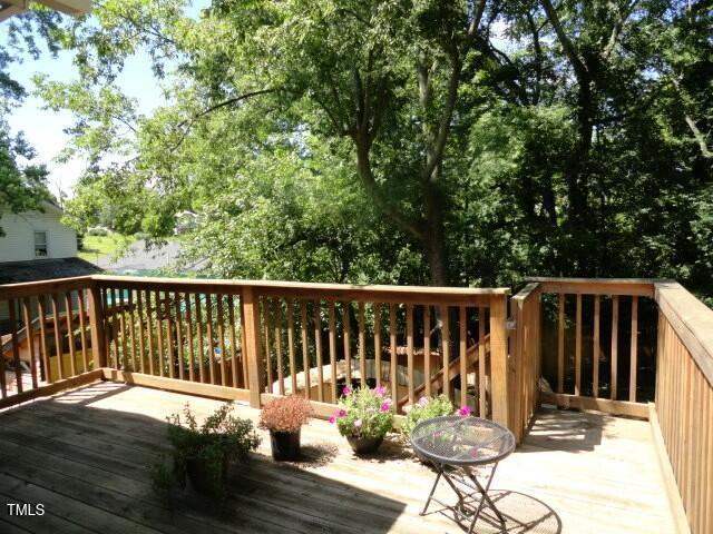 407 Ottawa Avenue Durham, NC 27701 - Photo 25 of 32 a view of a chair and table on the wooden floor