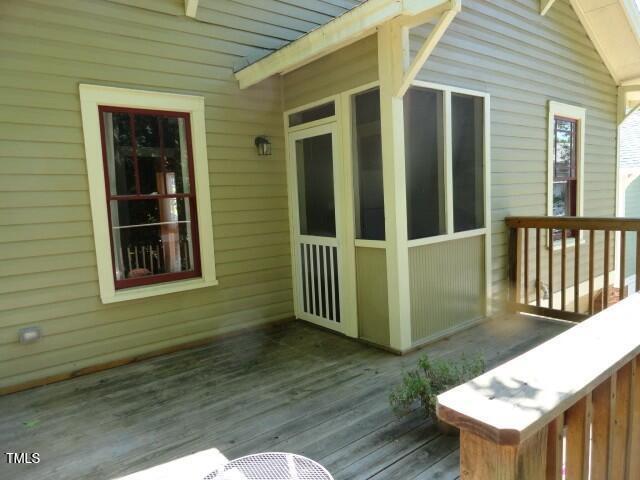 407 Ottawa Avenue Durham, NC 27701 - Photo 26 of 32 a view of a deck with wooden floor and a yard