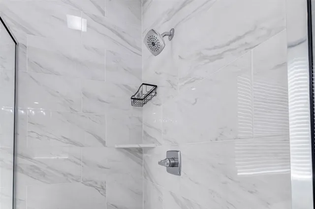 a bath tub sitting in a bathroom next to a window