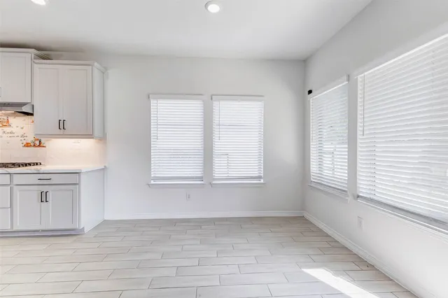 a view of a kitchen with dishwasher and a window