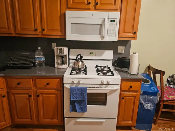 a kitchen with wooden floors and a stove