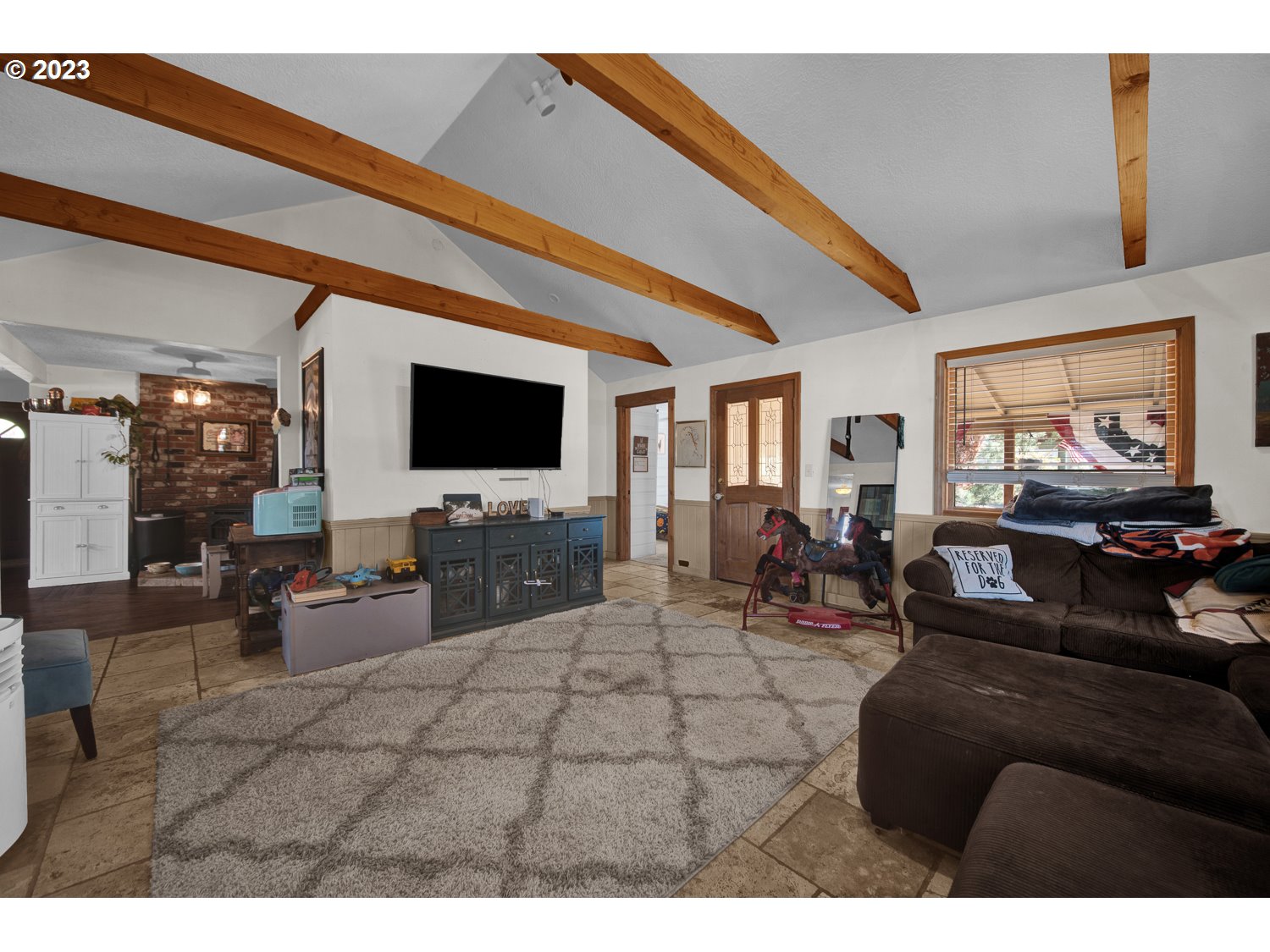 67100 Fryrear Road Bend, OR 97703 - Photo 11 of 37 a living room with furniture and a flat screen tv