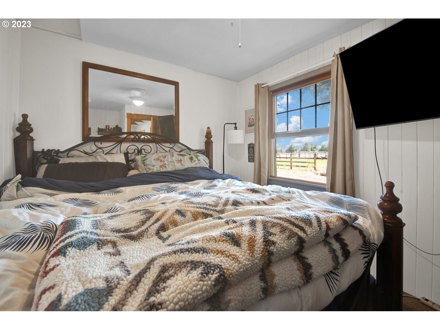 67100 Fryrear Road Bend, OR 97703 - Photo 16 of 37 a bedroom with a bed and window