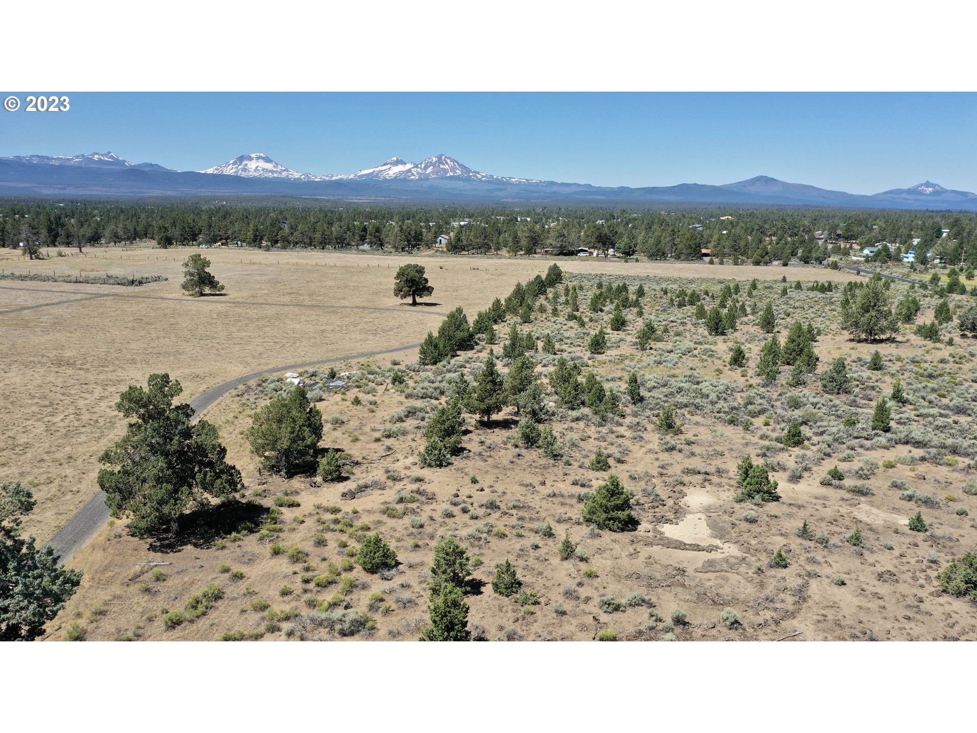 67100 Fryrear Road Bend, OR 97703 - Photo 22 of 37 a view of lake with mountain and trees