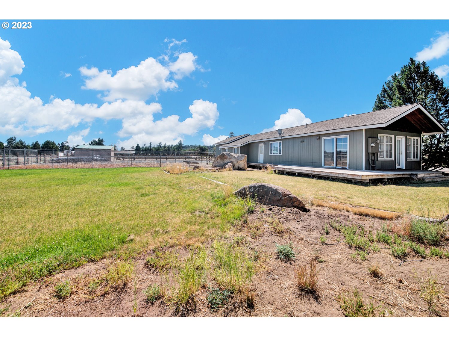 67100 Fryrear Road Bend, OR 97703 - Photo 23 of 37 a view of a house with swimming pool and sitting area