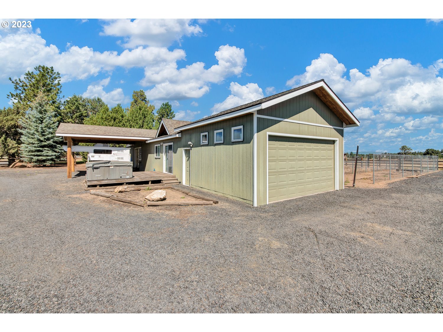 67100 Fryrear Road Bend, OR 97703 - Photo 26 of 37 a front view of a house with a yard and garage