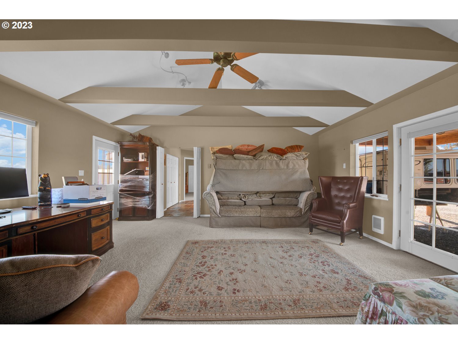 67100 Fryrear Road Bend, OR 97703 - Photo 28 of 37 a living room with furniture a flat screen tv and chairs