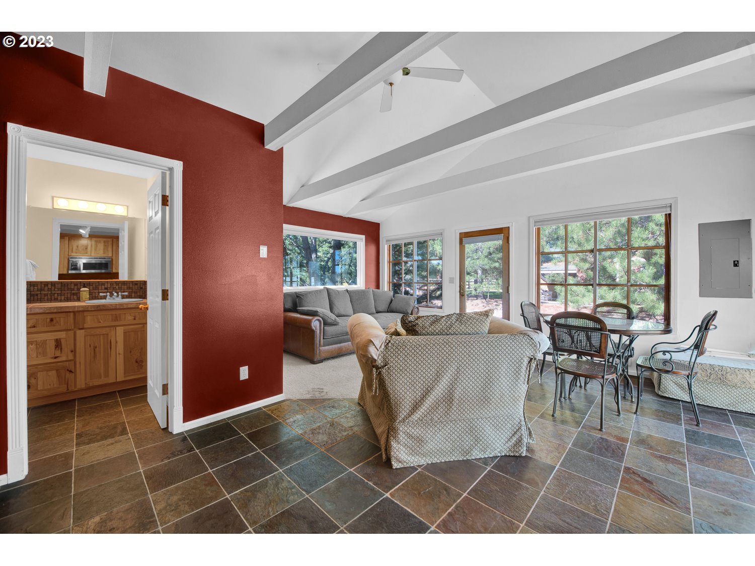 67100 Fryrear Road Bend, OR 97703 - Photo 31 of 37 a living room with furniture a large window and a dining table
