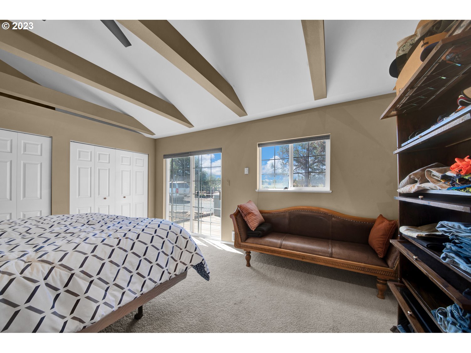 67100 Fryrear Road Bend, OR 97703 - Photo 35 of 37 a bedroom with furniture and a window