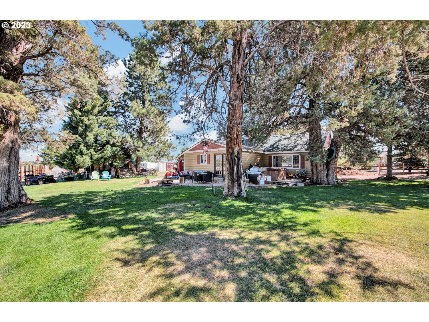 67100 Fryrear Road Bend, OR 97703 - Photo 7 of 37 a front view of a house with a garden