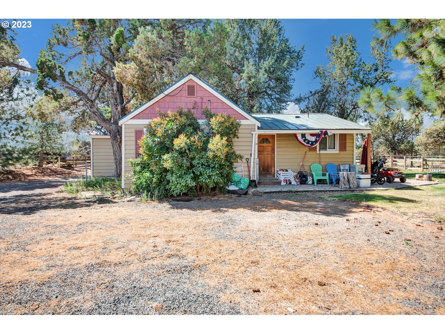 67100 Fryrear Road Bend, OR 97703 - Photo 8 of 37 a front view of a house with a yard and garage