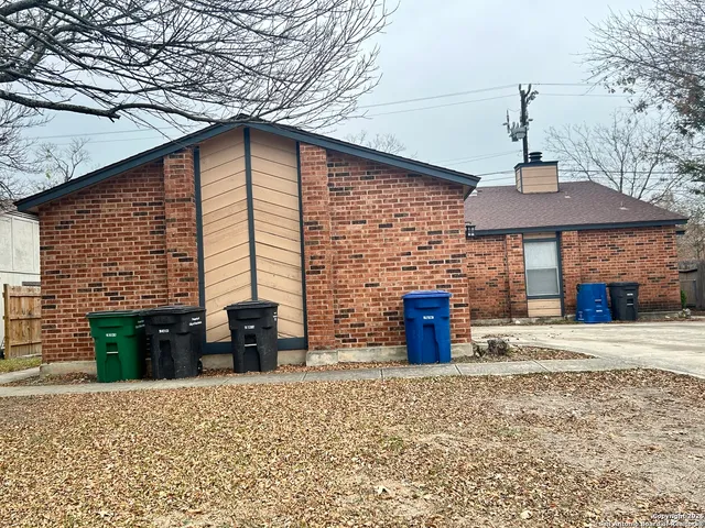 a front view of a house with barbeque