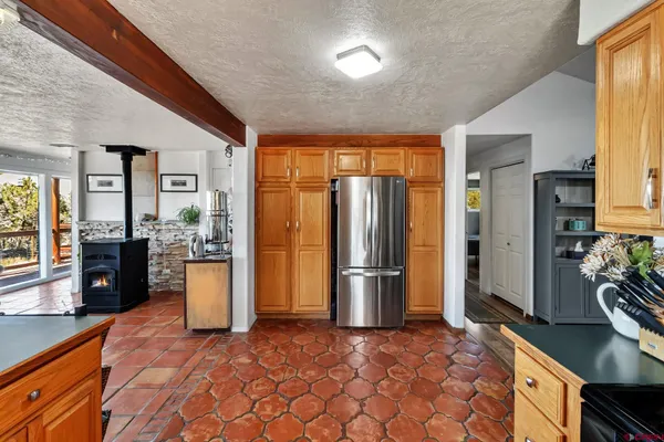 a kitchen with refrigerator and stove