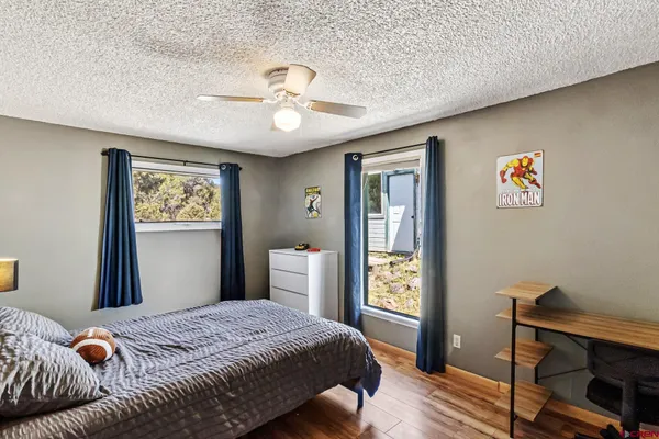 a bedroom with bed and a window