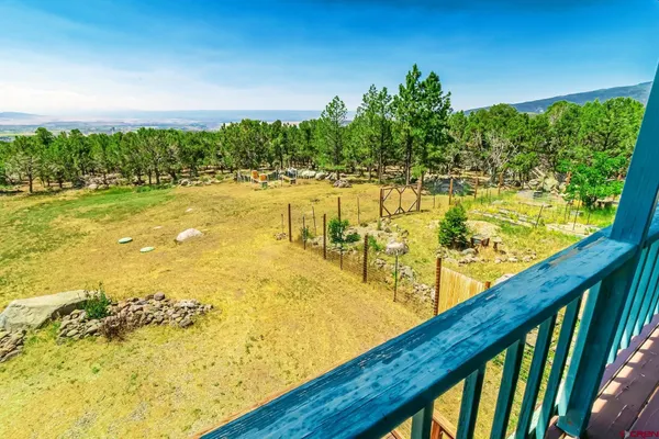 a view of swimming pool from a balcony