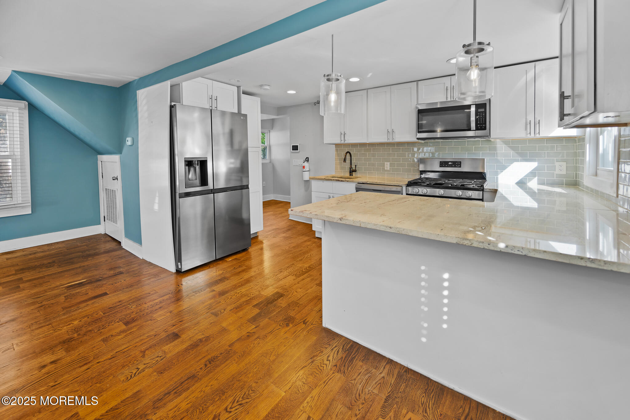 605 Ocean Gate Avenue Ocean Gate, NJ 08740 - Photo 15 of 45 a kitchen with stainless steel appliances a refrigerator sink and microwave