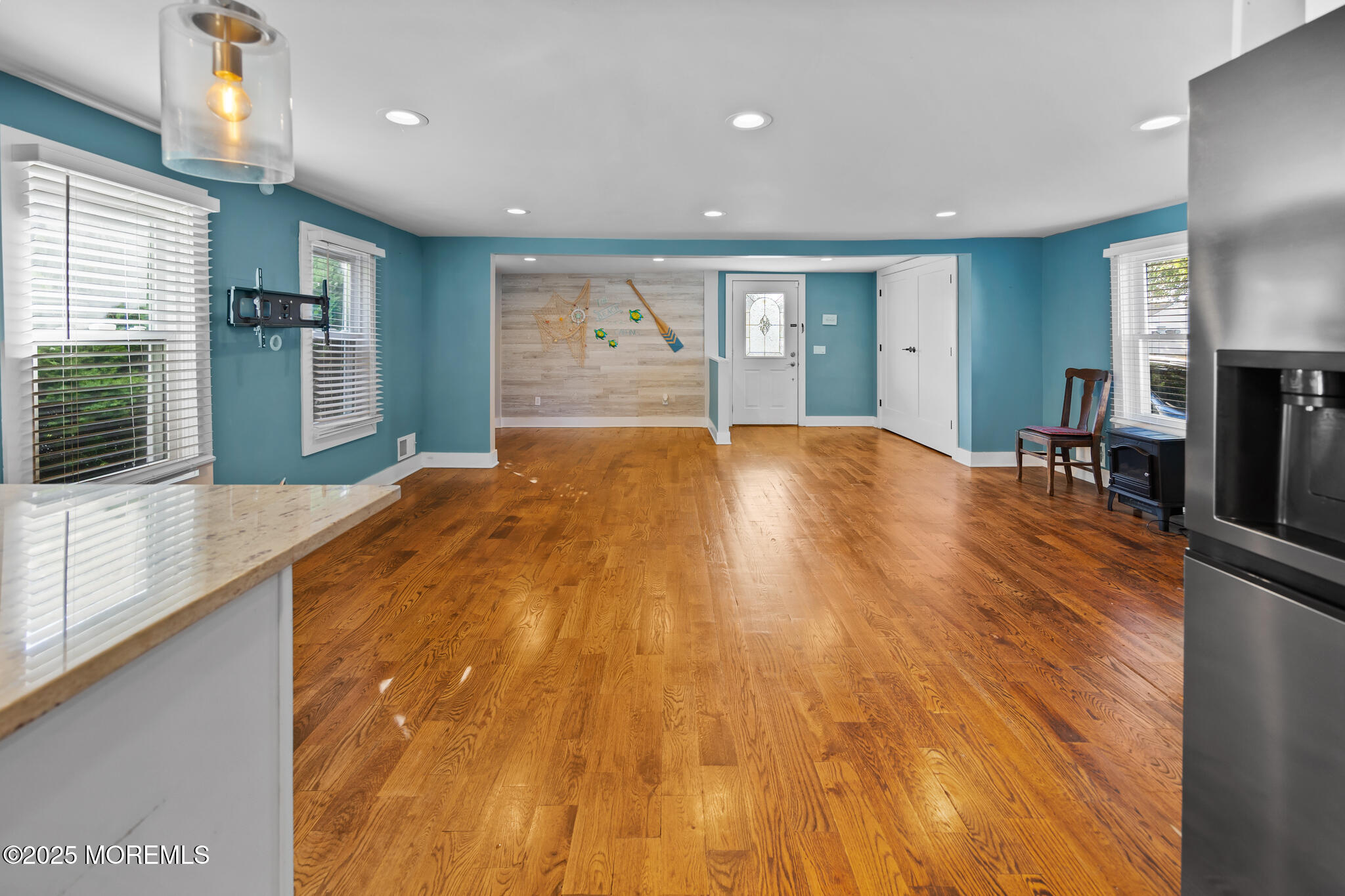 605 Ocean Gate Avenue Ocean Gate, NJ 08740 - Photo 18 of 45 a big room with wooden floor and windows