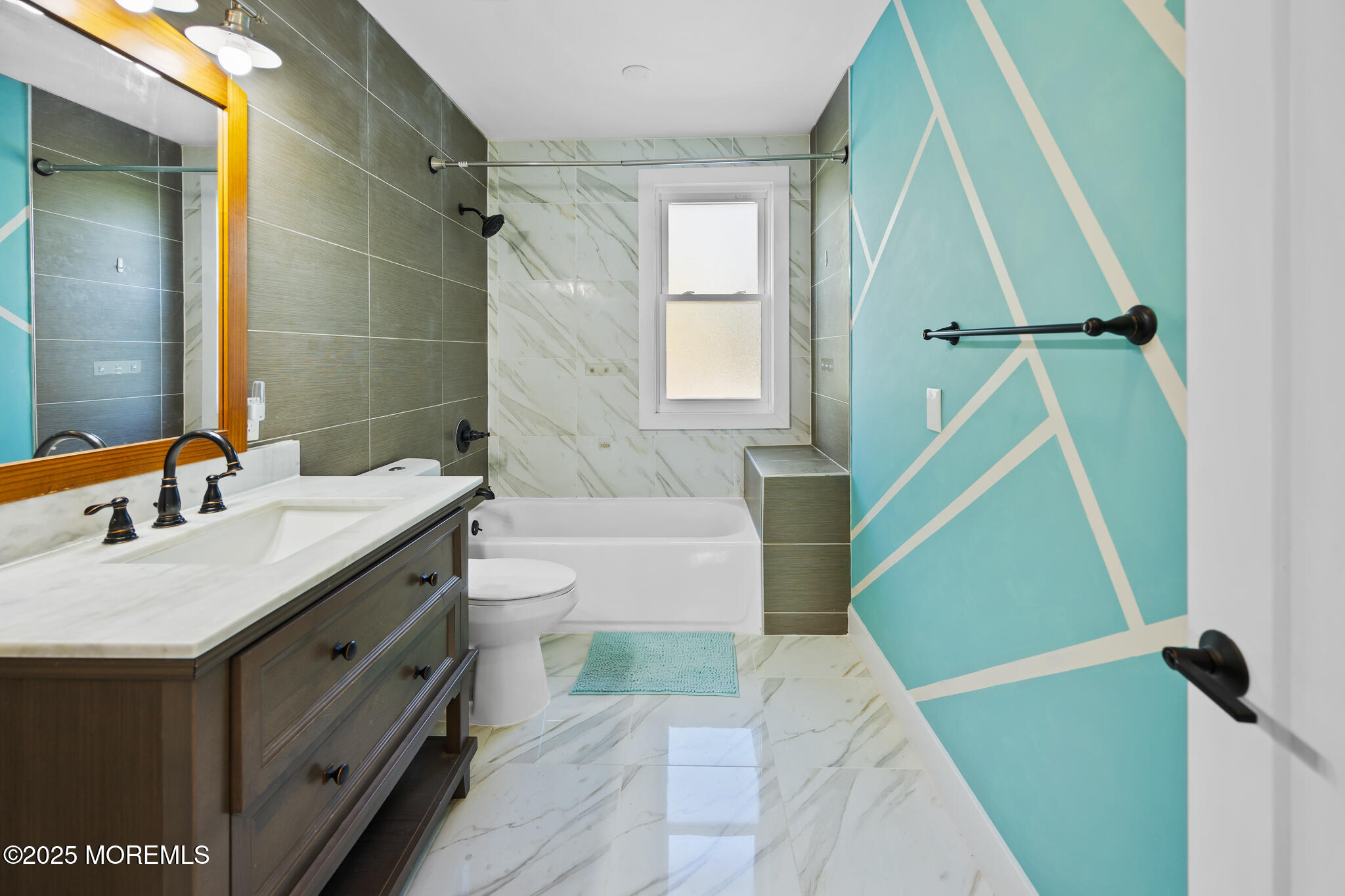 605 Ocean Gate Avenue Ocean Gate, NJ 08740 - Photo 35 of 45 a bathroom with a sink a toilet and shower