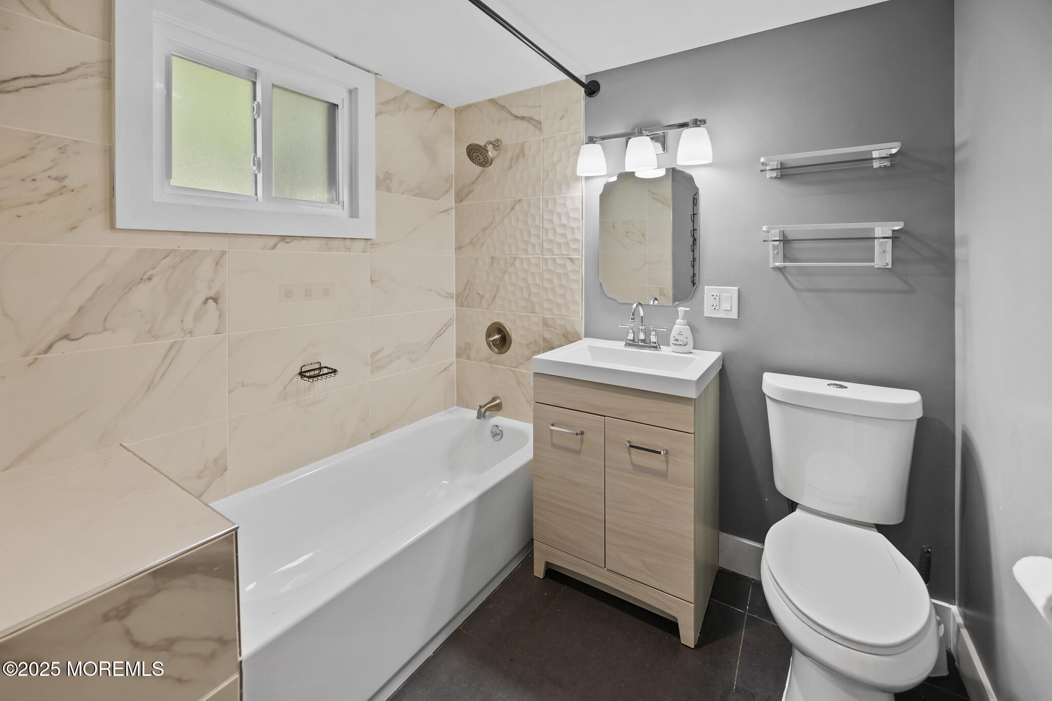 605 Ocean Gate Avenue Ocean Gate, NJ 08740 - Photo 39 of 45 a bathroom with a toilet sink and mirror