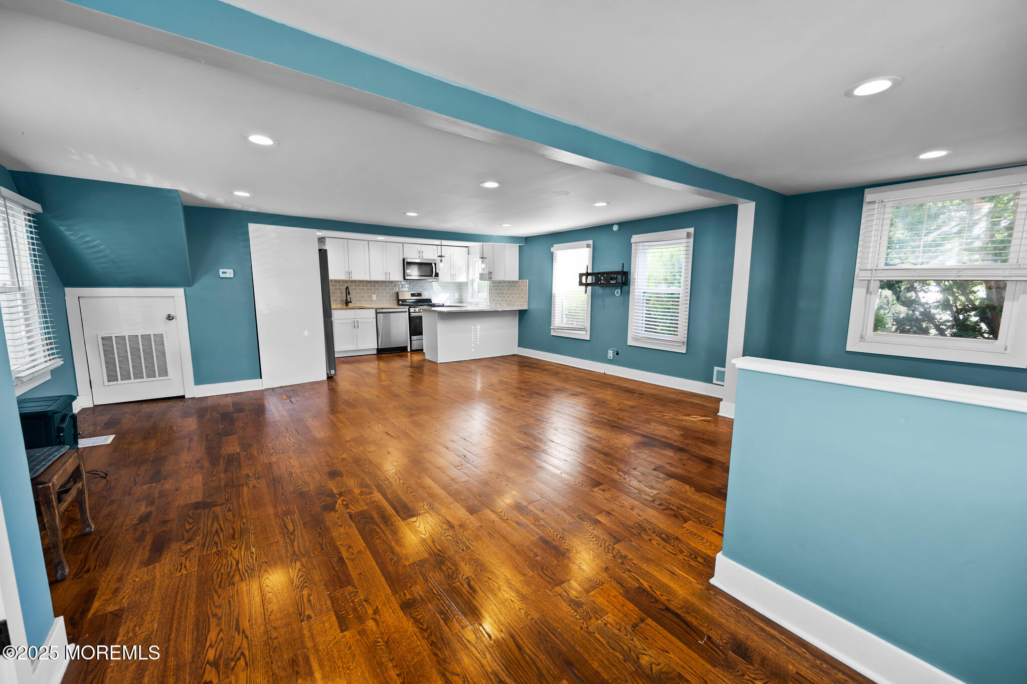 605 Ocean Gate Avenue Ocean Gate, NJ 08740 - Photo 4 of 45 a view of an empty room with window and wooden floor