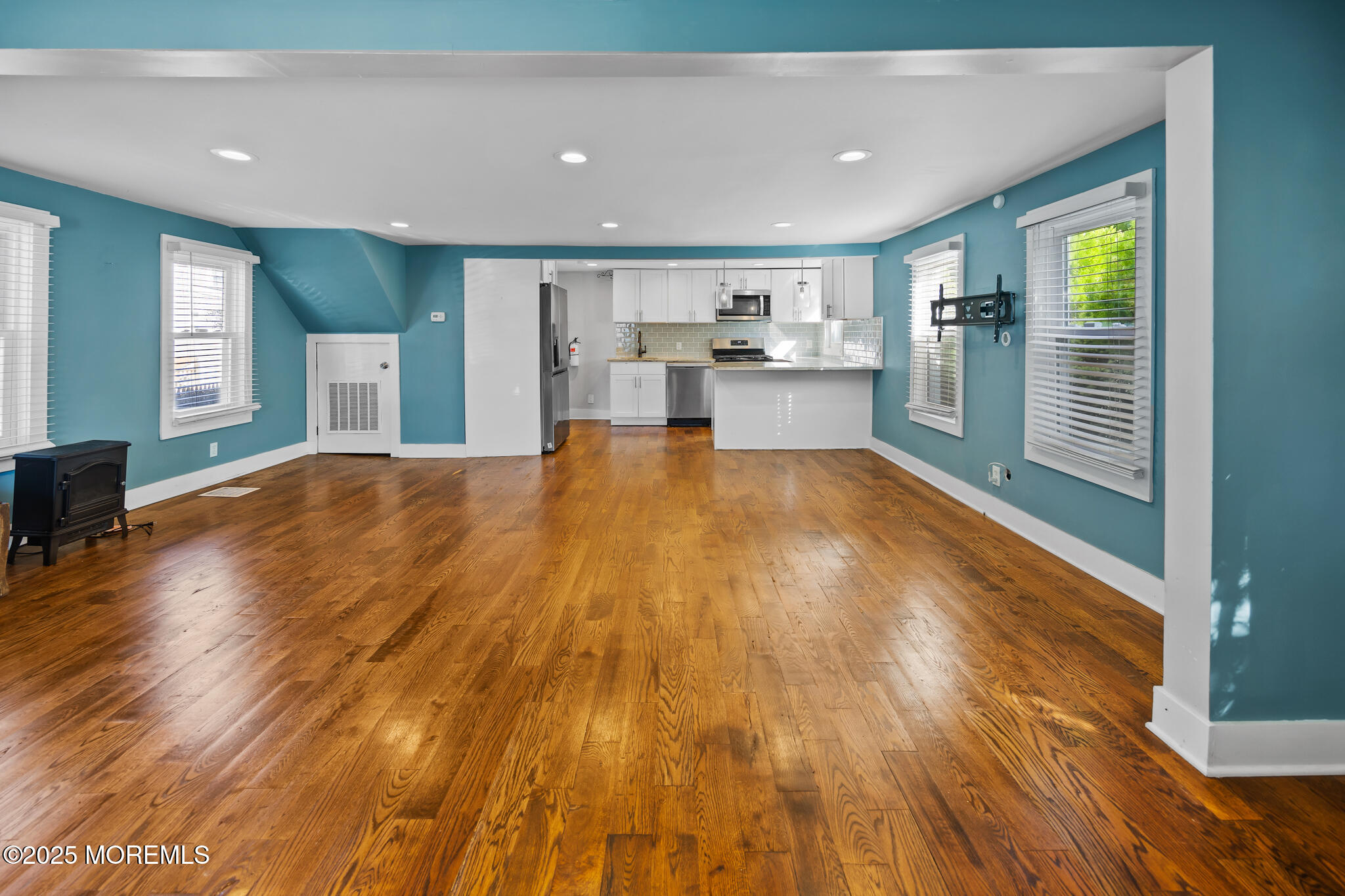 605 Ocean Gate Avenue Ocean Gate, NJ 08740 - Photo 5 of 45 a big room with wooden floor and windows