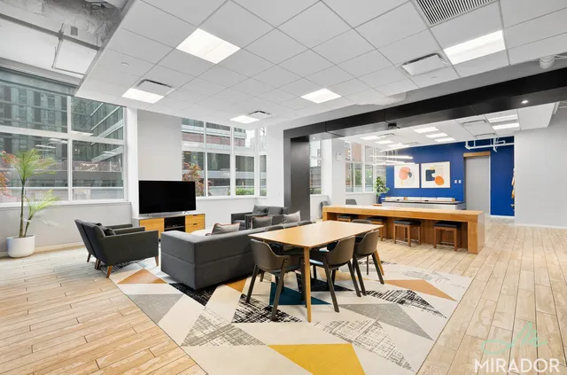 a view of a workspace with furniture