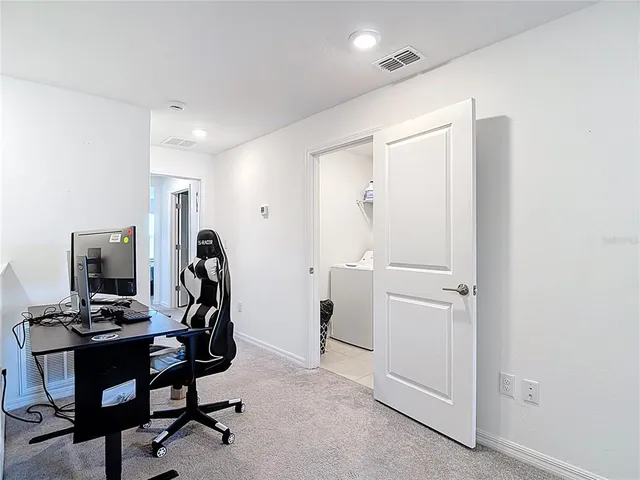 a view of a workspace with furniture