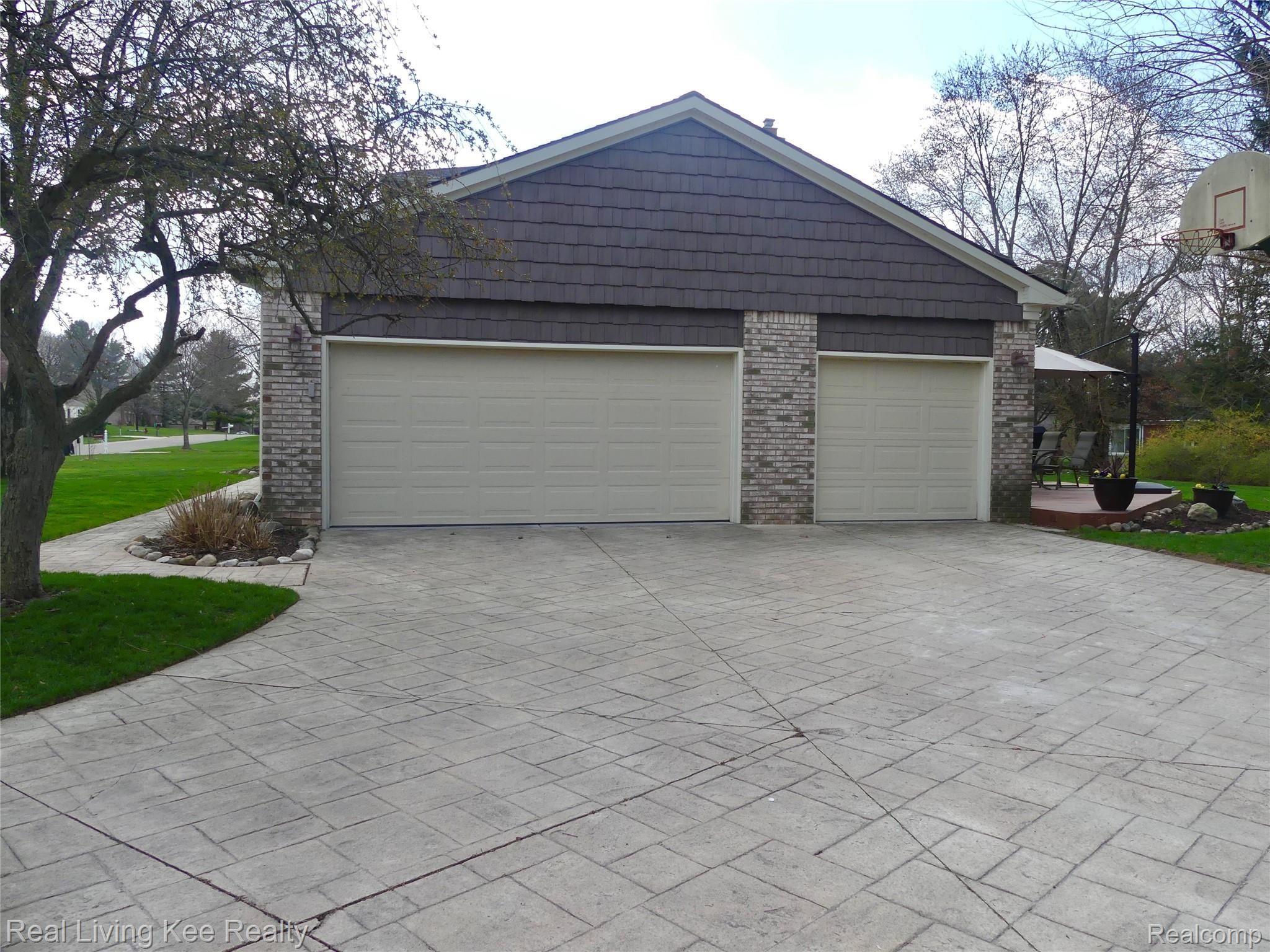 5164 Aintree Road Rochester, MI 48306 - Photo 46 of 47 3 car garage, brick paver driveway and walkway