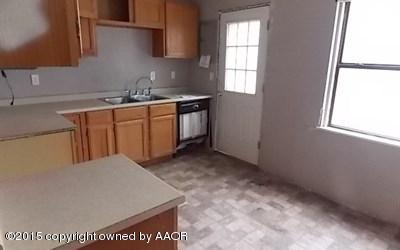 4126 Gables Street Amarillo, TX 79110 - Photo 7 of 15 a room with a sink cabinets and wooden floor