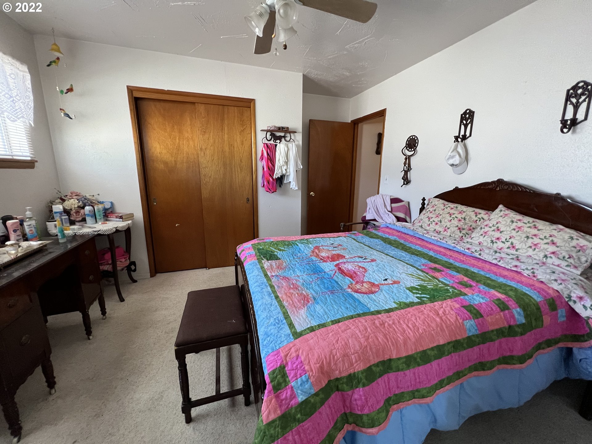 80500 Craig Road Hermiston, OR 97838 - Photo 15 of 24 a bedroom with a bed and a lamp on dresser