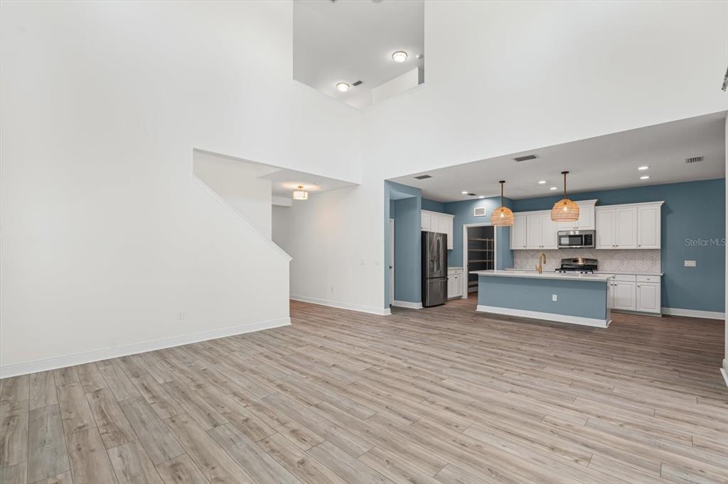 4457 Sage Grn Terrace Sarasota, FL 34243 - Photo 14 of 51 a view of kitchen with kitchen island wooden floor center island and stainless steel appliances
