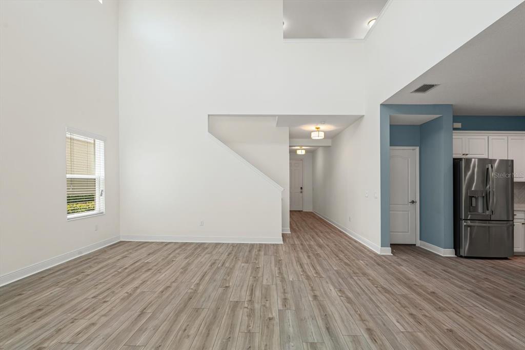 4457 Sage Grn Terrace Sarasota, FL 34243 - Photo 16 of 51 wooden floor in an empty room with a window