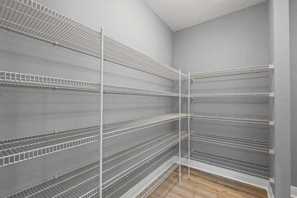 4457 Sage Grn Terrace Sarasota, FL 34243 - Photo 21 of 51 a view of a room with rack on the wall