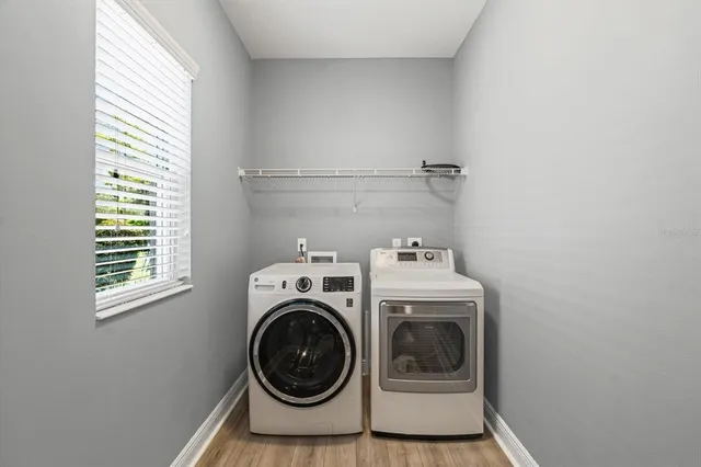 a utility room with dryer and washer