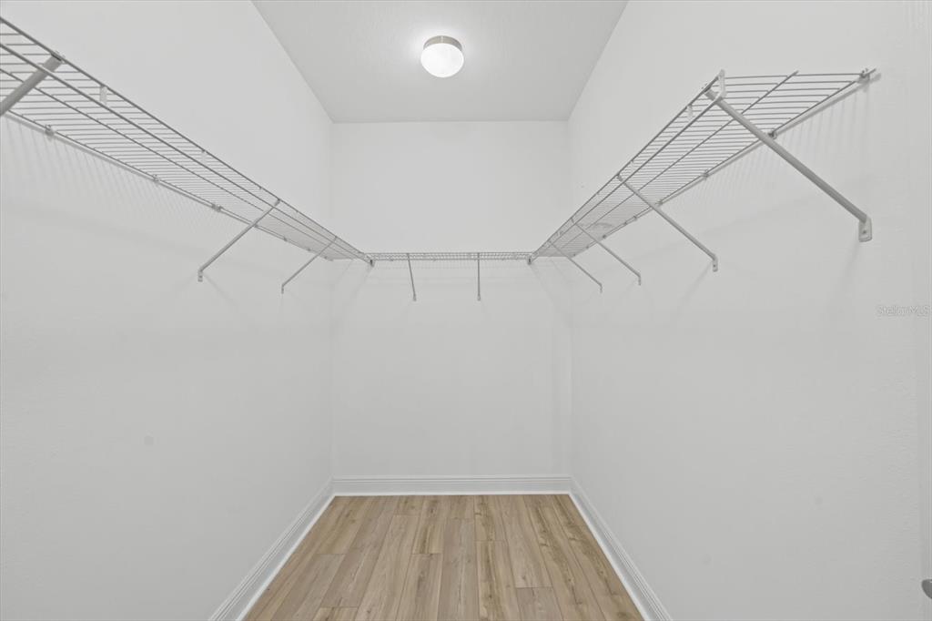 4457 Sage Grn Terrace Sarasota, FL 34243 - Photo 29 of 51 a view of a room with racks on the wall