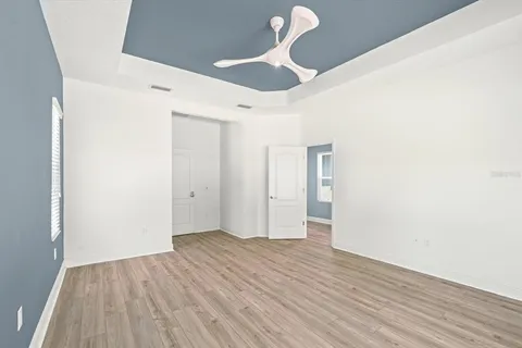 a view of entryway with furniture and wooden floor