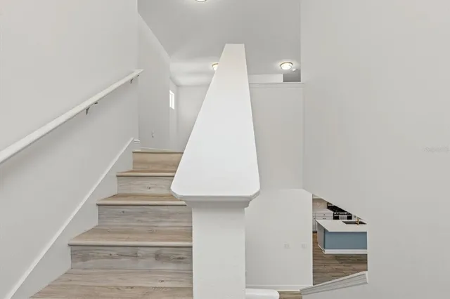 a view of entryway with furniture and wooden floor