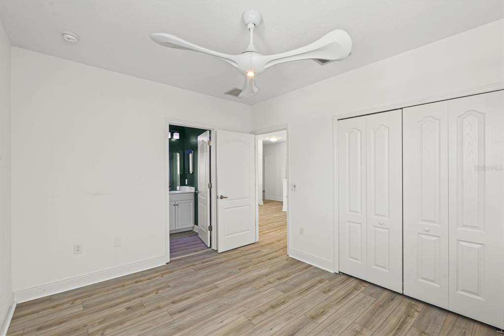 4457 Sage Grn Terrace Sarasota, FL 34243 - Photo 38 of 51 a view of an empty room with wooden floor