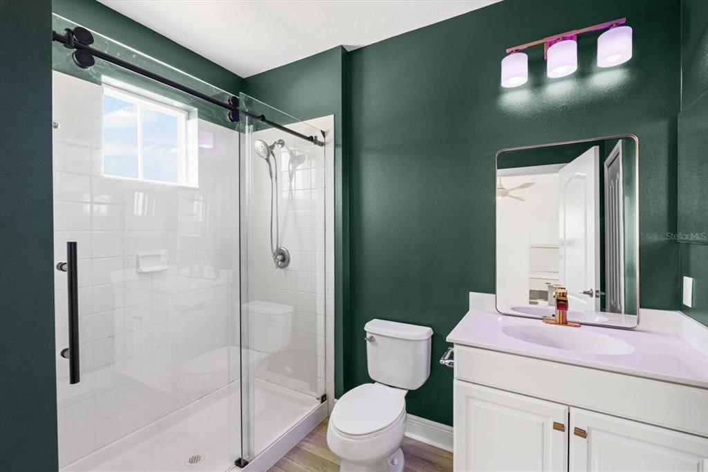 4457 Sage Grn Terrace Sarasota, FL 34243 - Photo 39 of 51 a bathroom with a sink toilet and shower