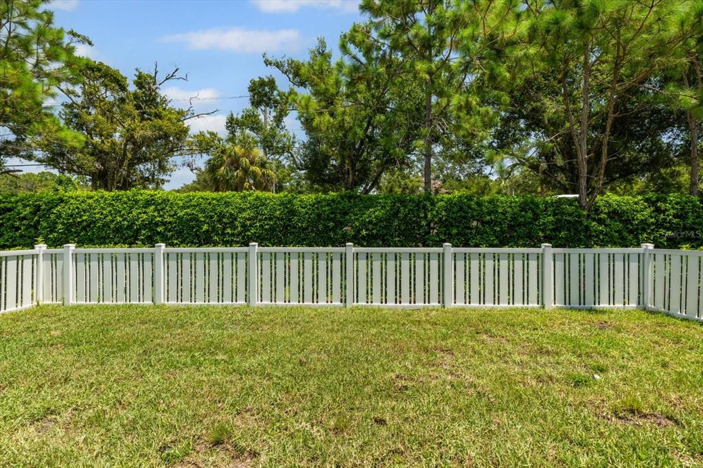 4457 Sage Grn Terrace Sarasota, FL 34243 - Photo 46 of 51 a view of backyard with wooden fence