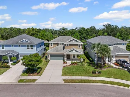 an aerial view of residential house with outdoor space and parking