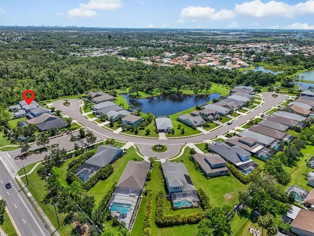an aerial view of residential houses with outdoor space
