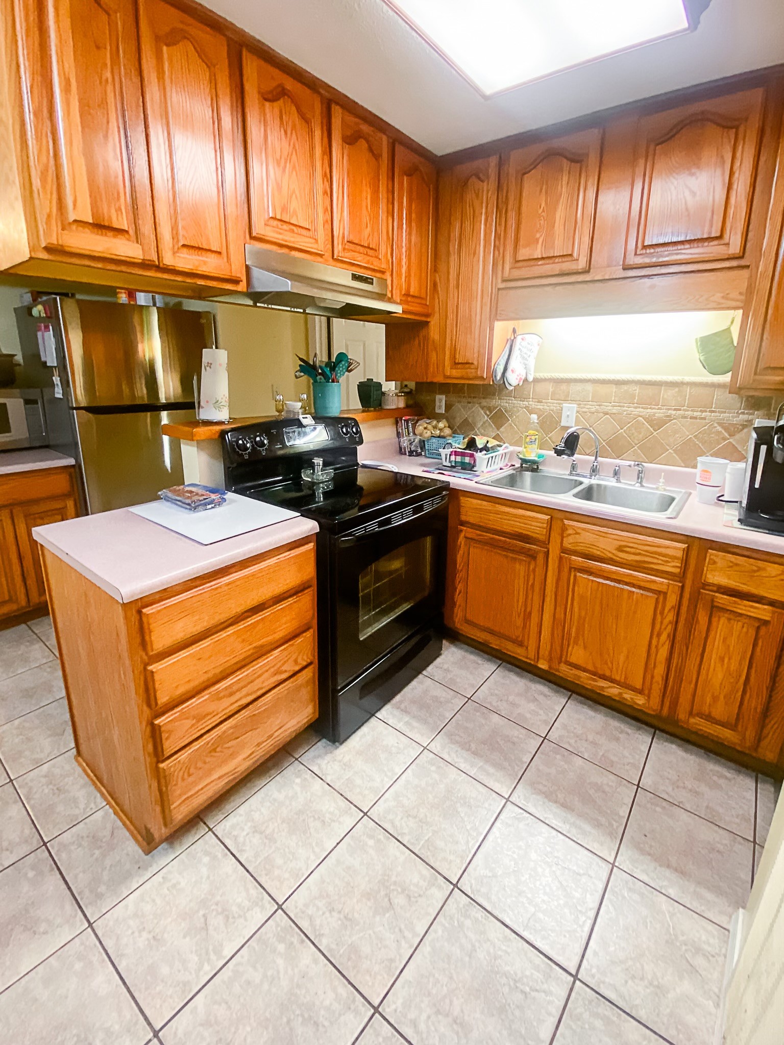1885 Luther Sharp Road Columbia, TN 38401 - Photo 18 of 24 a kitchen with stainless steel appliances granite countertop a sink stove and cabinets