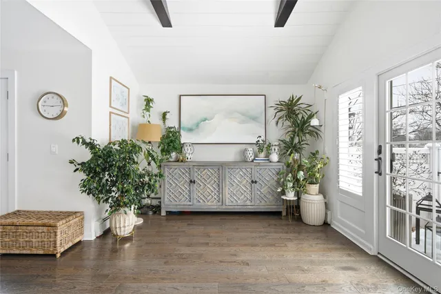 a view of room with furniture and a potted plant