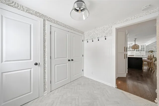 a view of a hallway view with dining table and chairs