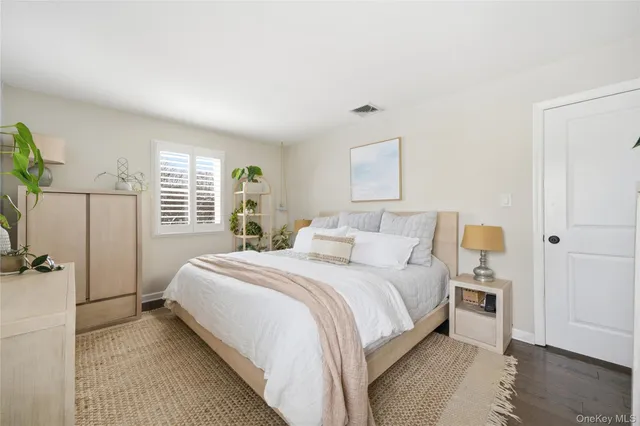 a bed room with a bed and a tv