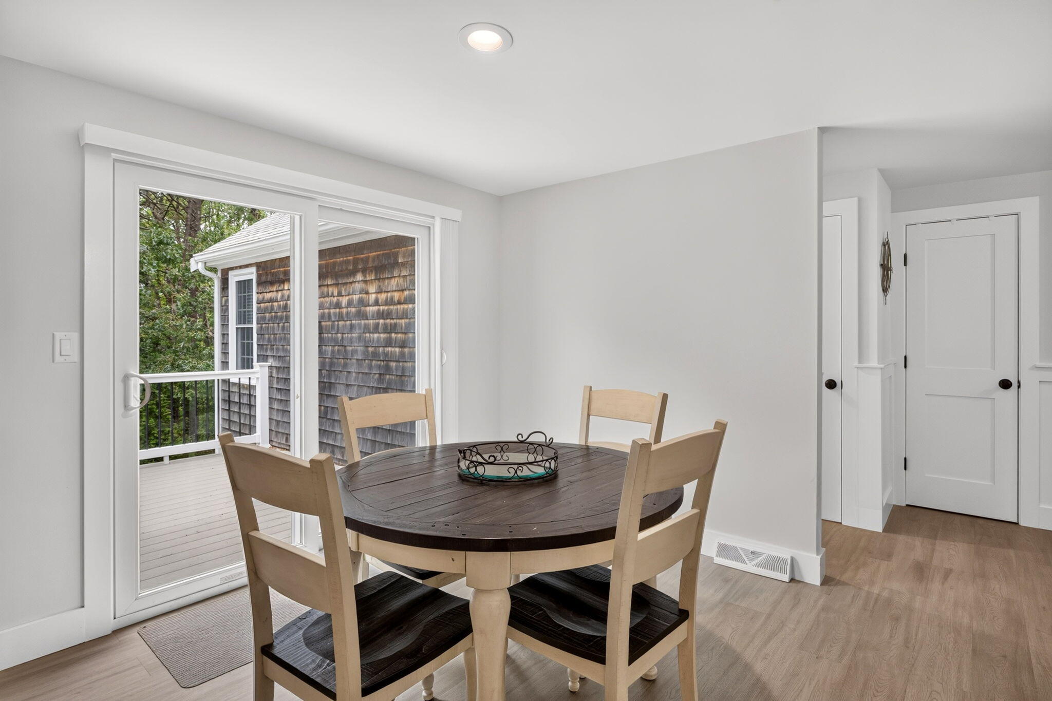 35 Debs Hill Road, Unit 35 Yarmouth Port, MA 02675 - Photo 27 of 36 a view of a dining room with furniture and wooden floor