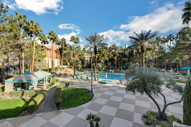 230 East Flamingo Road, Unit 435 Las Vegas, NV 89169 - Photo 13 of 15 An oasis of leisure awaits with a sparkling pool and lush landscaping.