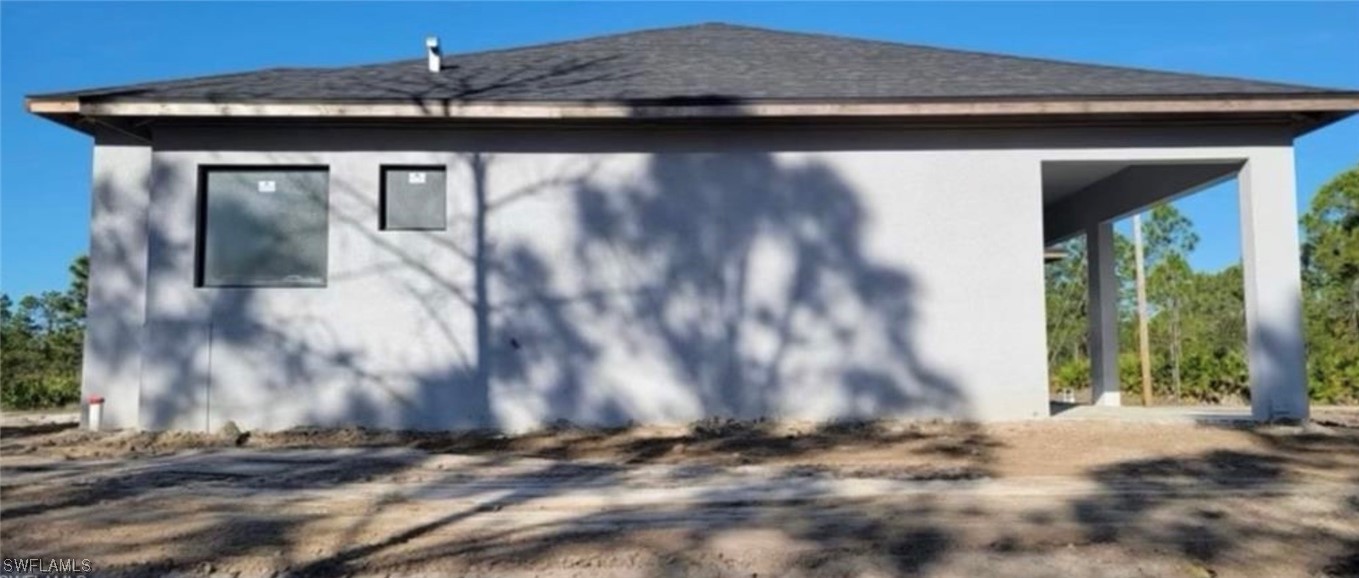 1907 West 9th Street Lehigh Acres, FL 33972 - Photo 3 of 3 a view of a house with a wooden door